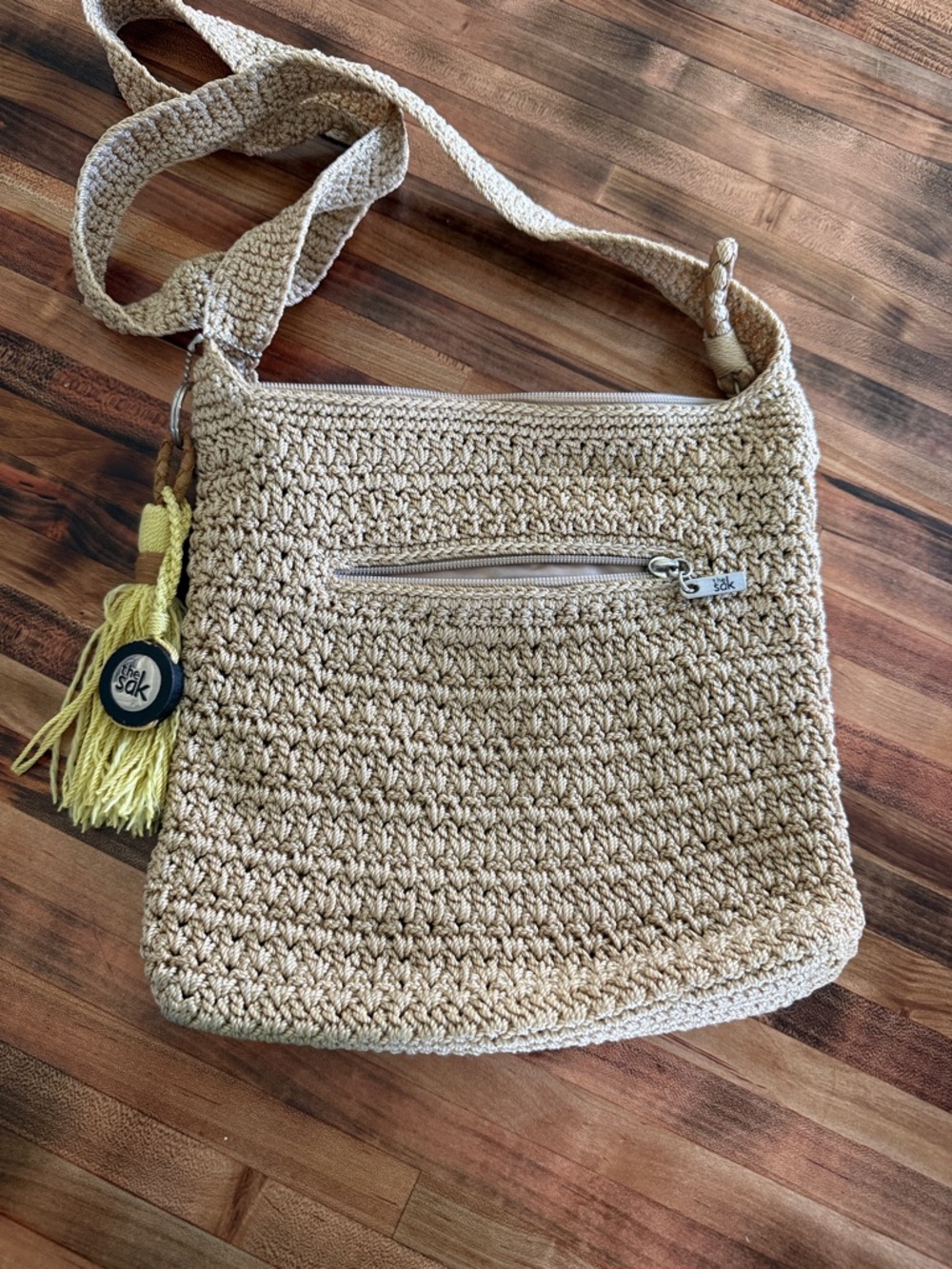 The Sak Beige Crochet Crossbody with Yellow Tassel Charm